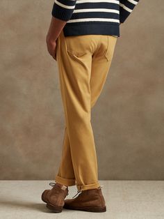 A customer favorite made even better and more sustainably thanks to luxuriously soft, high-stretch Italian fabric with a subtle, twill texture.  ATHLETIC TAPERED FIT: Not just for athletes, this fit is designed to deliver a modern, slim fit for tho Travel Pants, Italian Fabric, Tapered Legs, Khaki Pants, Slim Fit, Yellow, Pants