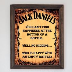 a sign on the wall that says jack daniels you can't find happiness at the bottom of a bottle