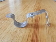 a close up of a metal object on a wooden table