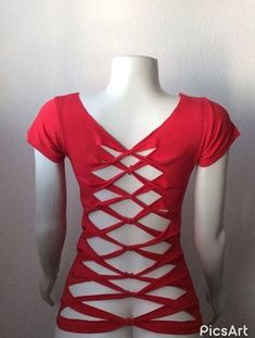 a mannequin wearing a red top with cutouts on it's back