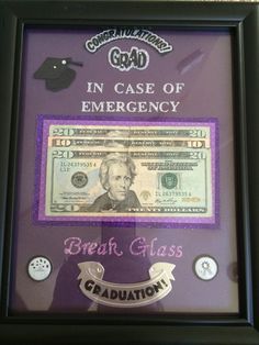 a framed money bill with the words in case of emergency and graduation cap on it