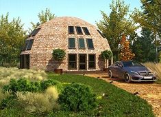 a car is parked in front of a round house