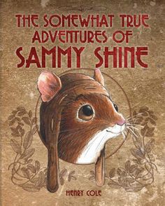 the book cover shows a brown and white mouse with an ornate border around its head