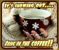 a woman holding a cup of coffee in her hands with snowflakes on it