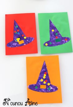 three pieces of paper that have been made to look like witches hats