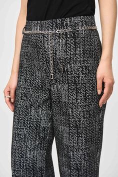 Take your polished look from morning to evening with these knit pull-on pants. Crafted in a luxurious tweed fabric, this modern piece effortlessly blends style and comfort. The design boasts a chic wide-leg silhouette that flows with every step and the delicate chain belt elevate the pants timeless allure. DETAILS & CARE 72% Polyester, 24% Cotton, 4% Spandex Tweed knit fabric Hidden elastic waistband Unlined Hand wash in cold water with like colors Do not bleach Lay flat to dry in the shade Do n Black And White Tweed, Classic Trousers, Leopard Print Scarf, Business Style, Fur Lined Boots, Belted Pants, Tweed Fabric, Joseph Ribkoff, Delicate Chain