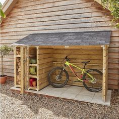 a wooden shed with a bicycle in it