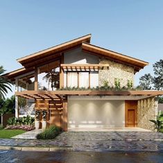 a house that is sitting in the middle of some grass and rocks with plants growing on it