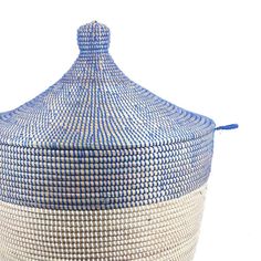 a blue and white basket sitting on top of a table