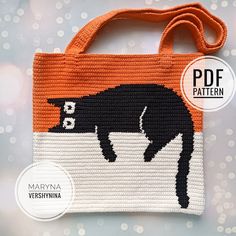 an orange and white bag with a black cat on the front is featured in this pattern