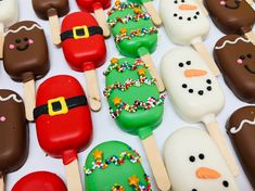 many pops are decorated to look like santa's helper and snowman faces