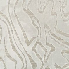 a white and beige fabric with wavy lines on the side, as well as an abstract design