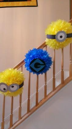 three yellow and blue decorations on the banister