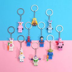 the lego keychains have been placed on top of each other in different colors