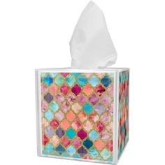 a tissue box with colorful tiles on it and a white paper towel in the middle