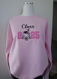 Class of 2025 Senior gradation gift, Class of  2025 Sweatshirt, Class of 2025 kitty sweater, Trendy Class 2025 Sweatshirt  pink Crewneck  8 oz., 50% Cotton/ 50% Polyester  Our sweatshirts run in unisex sizes, if between sizes or for a loose fit I recommend to size up. Make sure to choose your size accordingly! A size chart with measurements is listed, see photos. Washing Instructions: - Turn garment inside out - Hand wash or delicate was cycle - Wash in cold water - Use mild detergent - Do NOT u Senior Hoodies Design Ideas, Senior Painted Jeans, Hoodies Design Ideas, Senior Sweatshirts, Kitty Sweater, Class Of 2025, Painted Jeans, Pink Crewneck, Hoodies Design