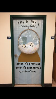 a door with an advertisement on it that says, life is like a snow globe