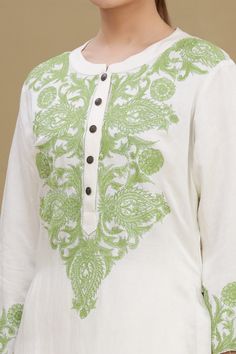 White kurta with pistachio green thread embroidery at the placket and sleeves. Comes with straight fit pant.
Component: 2
Embroidered
Neckline: Mandarin Collar
Sleeve Length: Full
Fabric: Linen Satin Blend
Color: White
Front button placket
Pom-pom detailing at the side seams
Embroidered straight fit pant - Aza Fashions Green Chikankari Embroidery Top For Wedding, Green Chikankari Embroidered Top For Wedding, Green Cotton Kurta With Embroidered Border, Green Straight Kurta With Intricate Embroidery, Green Straight Kurta With Embroidered Border, Green Embroidered Straight Kurta, Pista Green Traditional Wear With Chikankari Embroidery, Pista Green Long Sleeve Traditional Wear With Chikankari Embroidery, Green Embroidered Straight Kurta Top