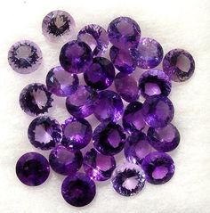 an assortment of amethorate and diamond rings, with pictures of them in purple