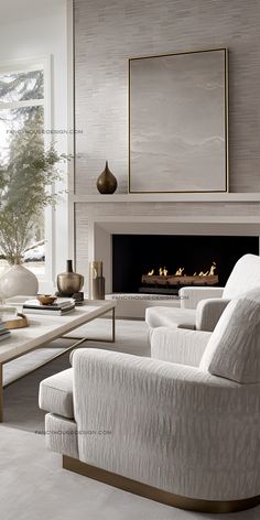 a living room with white furniture and a fireplace