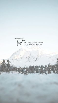 a snowy mountain with the words in the lord with all your heart