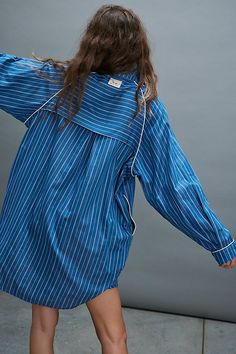 Take it easy in this oversized long-sleeve sleep shirt from We The Free, featured in a PJ-inspired button-down style with a classic pinstripe print and clean piping throughout. **Fit:** Oversized, relaxed **Features:** Cotton-lyocell blend, collared neckline, button-front closure, pinstripe print, piping throughout, rounded hem, logo tag at back **Why We | We The Free Day To Day Sleep Shirt at Free People in Blue, Size: M Free Day, Logo Tag, Take It Easy, Day To Day, Sleep Shirt, To Day, Boho Outfits, Piping, Shirt Shop