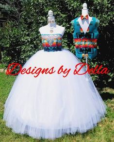 the dress is white and has colorful designs on it, with red lettering that reads designs by delta