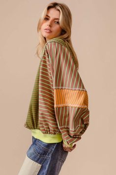 Stay on trend with this Color Block Striped Round Neck Sweatshirt, perfect for adding a pop of color to your wardrobe. The stylish design features bold stripes in complementary colors that will make a statement wherever you go. Made from high-quality materials, this sweatshirt is comfortable and versatile, perfect for casual outings or lounging at home. Pair it with your favorite jeans or leggings for a chic and casual look. Features: Exposed seam Neckline: Round Sleeve: Long Sheer: Opaque Stret Spring Color Block Athleisure Sweatshirt, Spring Athleisure Color Block Sweatshirt, Retro Spring Sweater With Ribbed Cuffs, Casual Striped Sleeve Tops For Fall, Green Color Block Tops For Layering, Oversized Color Block Athleisure Top, Trendy Color Block Sweatshirt For Loungewear, Athleisure Color Block Cotton Top, Trendy Oversized Striped Sweater