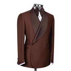 Package Includes: 1 x Jacket - 1 x Pant

Introducing the Chocolate Brown Tuxedo, a masterpiece of sophistication and style. Crafted from premium 120s fabric, this tuxedo combines luxury and comfort, perfect for any formal occasion. The double-breasted design with two buttons exudes timeless elegance, while the dark brown shawl lapel adds a refined touch. Whether you're attending a wedding, gala, or any high-profile event.

 	Fabric: 120s 
 	Lining Fabric: Silk
 	Pattern: Plain
 	Buttons: Fabric
 	Construction: Half Canvas
 	Seasonality: All Season
 	Jacket: Dark Brown Shawl Lapel, 3 Straight Pockets, Double Breasted With 2 Buttons
 	Trouser: Flat front, 2 Back Pockets, Zip Closure Elegant Custom Fit Brown Blazer, Elegant Brown Custom Fit Blazer, Formal Brown Custom Fit Blazer, Brown Custom Fit Blazer For Formal Occasions, Luxury Semi-formal Three-piece Suit With Long Sleeves, Luxury Three-piece Suit For Semi-formal Occasions, Formal Brown Suit With Pressed Crease, Brown Suit With Pressed Crease For Formal Occasions, Formal Brown Suit With Single Button