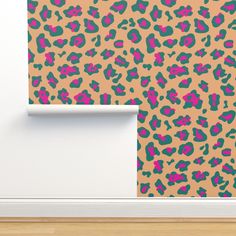 an animal print wallpaper with pink, green and blue leopard spots on the background