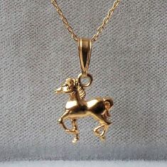 18ct Gold over Sterling Silver Horse Pony Pendant Necklace horse dimensions: 12mm x 14mm material: 18ct gold over sterling silver. Classic Yellow Gold Charm Necklaces, Classic Gold Charm Necklaces With Polished Finish, Elegant Yellow Gold Jewelry With Horse Design, Classic Horse Design Pendant Necklace, Elegant Gold Jewelry With Horse Design, Classic Gold Charm Necklace For Formal Occasions, Gold Horse Design Pendant Necklace, Classic Necklace With Horse Design For Gift, Formal Horse Design Pendant Jewelry