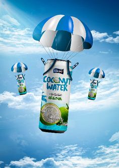 an advertisement for coconut water flying in the sky with parachutes attached to it's sides