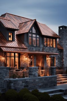 a large house with stone walls and metal roofing