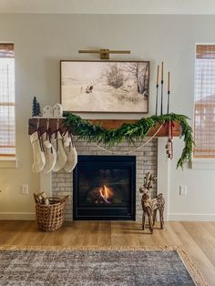 a fireplace with stockings hanging from the mantle