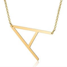 a gold necklace with the letter y on it