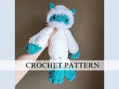 a crocheted teddy bear is being held by someone's hand with the words crochet pattern below it