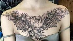 a woman's chest with an owl and flowers on it