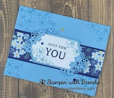 a blue card with flowers on it and the words just for you written in white