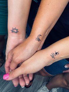 two people with matching tattoos on their arms