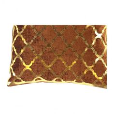 an orange and gold decorative pillow on a white background