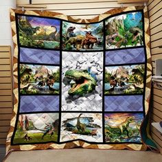 a quilt with pictures of dinosaurs on it