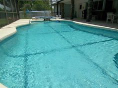 an empty swimming pool with clear blue water