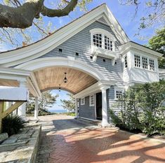 the front entrance to a house with an arched roof