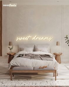 a bedroom with a bed, nightstands and a neon sign that says sweet dreams