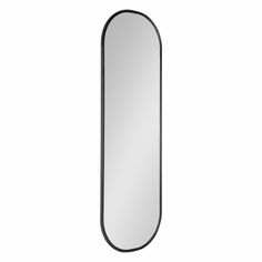 a mirror that is on the wall with a black border around it and an oval frame