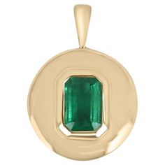 A stunning emerald signet hand-made pendant in solid 14K gleaming gold. This emerald cut-shaped emerald displays a beautiful rare medium rich green color and very good luster. The emerald is bezel set in a custom-made golden frame. A 14K cable chain is included with the pendant. Setting Style: Bezel Set Setting Material: 14K Yellow Gold Gold Weight: 6.2 grams Main Stone: Emerald Shape: Emerald Cut Weight: 1.80-carats Clarity: Transparent Color: Green Luster: Very Good Treatment: Natural, Oiling Emerald Style, Tiny Bow, Golden Frame, Solitaire Setting, Zambian Emerald, May Birthstone, Rich Green, Solitaire Pendant, Recycled Metal