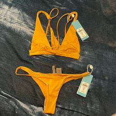 Medium Top Medium Bottom Nwt Strappy Swimwear For The Beach, Yellow Strappy Swimwear For Poolside, Yellow Strappy Swimwear For The Beach, Yellow Strappy Swimwear For Vacation, Yellow Strappy Swimwear For Beach, Beachy Strappy Swimwear For Vacation, Fitted Strappy Swimwear For Vacation, Yellow T-back Swimwear For Beach Season, Strappy Swimwear For Beach Party Vacation