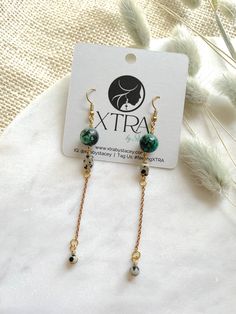 These are long, beaded, dangle earrings featuring 10mm African Turquoise beads, brass chain, and rectangular Dalmatian Jasper beads.These unique boho earrings hang approximately 3.75" inches from the lobe. The earwire is 18k gold plated and should be suitable if you have a metal allergy or sensitivity.These earrings are very lightweight and easy to wear. Bohemian Rectangular Earrings With Dangling Beads, Bohemian Rectangular Dangling Bead Earrings, Bohemian Dangle Nickel-free Earrings, Bohemian Dangle Nickel-free Linear Earrings, Bohemian Dangle Linear Earrings Nickel Free, Bohemian Nickel-free Dangle Earrings, Bohemian Drop Earrings With Adjustable Chain, Bohemian Linear Dangle Earrings With Ear Wire, Green Beaded Chain Drop Earrings