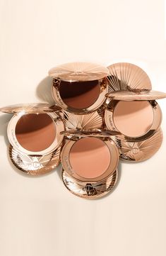 What it is: An oversized natural matte bronzer with hyaluronic acid, with finely milled pigments for a skin-perfecting filter for the face and body.What it does: Charlotte created this bronzer to blend with the skin and warm the look of your complexion, while blurring the appearance of any imperfections. Perfect for an allover face and body bronze, or to define and contour. It's encased in a golden sunbeam compact with a 16g fill—double the size of your average bronzer. How to use: Use your skin Brandy Makeup, Charlotte Tilbury Airbrush Bronzer, Hula Bronzer, Dream Makeup, Charlotte Tilbury Makeup, Bronze Makeup, Matte Bronzer, Flawless Foundation, Xmas List