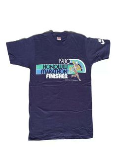 Very Rare***1980 Nike Honolulu Marathon Finisher t-shirt 💫perfect condition 💫no flaws in graphic or to the shirt 💫it has the same graphic on the back of the shirt! 💫size Medium ⛰The historic 1976 Honolulu marathon was the first in which Nike stepped in as a sponsor. The Olympian Duncan Macdonald won the first marathon in 1973. Then, went on to win in 1976 and 1980 as well.⛰ 💫This is the perfect piece for any vintage Nike collector. Shipped with USPS First Class. Retro Nike T-shirt With Letter Print, Nike Retro T-shirt With Letter Print, Nike Crew Neck T-shirt For Running, Retro Nike Sports Tops, Honolulu Marathon, First Marathon, Medium Rare, Honolulu, Vintage Nike